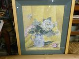 une photo d'une photo représentant des fleurs dans un vase posé sur une chaise