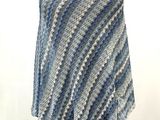 an image of a blue and white striped shawl on a mannequin