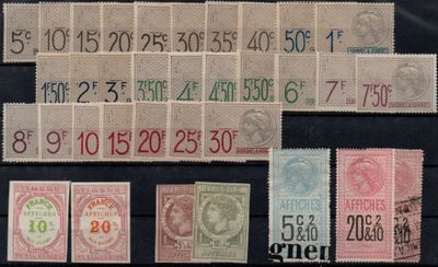 several different types of stamps on a black surface