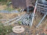 a pile of junk on the ground next to a truck