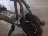 a scooter that is sitting on the floor in the room