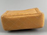chanel, a tan leather quilted purse, ca 1950