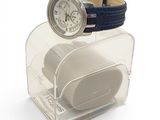 a watch that is sitting on top of a watch stand