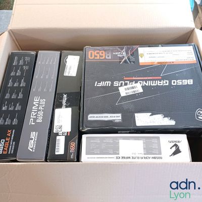 a box of assorted electronic devices sitting on a table