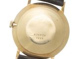 an image of a close up of a watch on a white surface