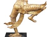 bronze statue of a man riding a horse with a bird on its back