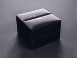 the box is black and has a silver logo on it
