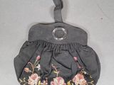 an image of a small purse with a flower design on it