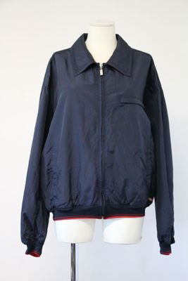the jacket is blue and red on a mannequin stand