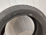 tire tread of a car on a white surface with a white background