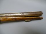 pair of antique wooden baseball bats on white surface