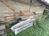 many pieces of wood sitting on the side of a building