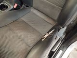 a picture of a car seat with a broken arm rest