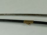 pair of antique japanese swords with brass fittings and leather sheaths