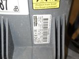 a close up of a parking meter with a sticker on it