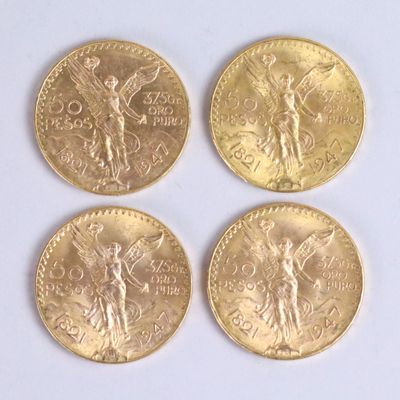 four different types of gold coins on a white surface