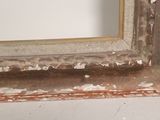 a picture of a window frame with peeling paint on it