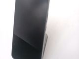a cell phone that is sitting on top of a stand