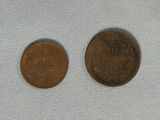 an image of a penny and a penny on a white cloth