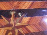 a wooden table with a star design on it
