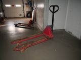 a fork and a pallet in a garage