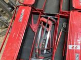 a red tool box with tools inside of it