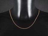 un collier à chaîne en or sur un mannequin mannequin mannequin mannequin mannequin mannequin mannequin mannequin mannequin mannequin