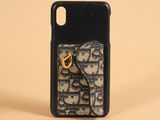 iphone case with a phone holder and a keychain on a beige background
