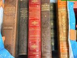 a bag full of books sitting on a table