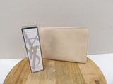 beige leather wallet with a card case on top of a wooden table