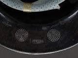 a close up of a metal object with holes on it