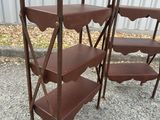 three tiered shelvings with scallops on top of them