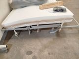 a bed that has a mattress on it in a room