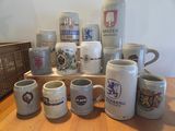 many different types of beer mugs sitting on a table
