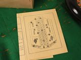 a drawing of a bingo card on a table next to a box of chips