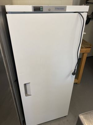 a white refrigerator that is sitting in a kitchen