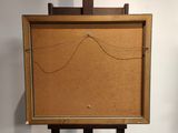a wooden easel with a cork board on top of it
