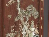 two wooden panels with a painting of birds and trees on them