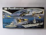 a box of legos on a table with a picture of a boat and a helicopter