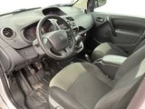 the interior of a small car with a steering wheel and dashboard