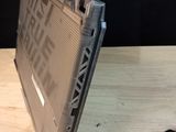 a laptop that is sitting on a table with a mouse