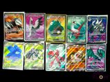 several different pokemon cards are lined up on a black surface