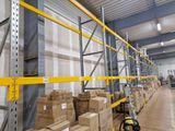 many boxes on the shelves in the warehouse