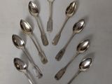 a lot of spoons arranged in a circle on the table