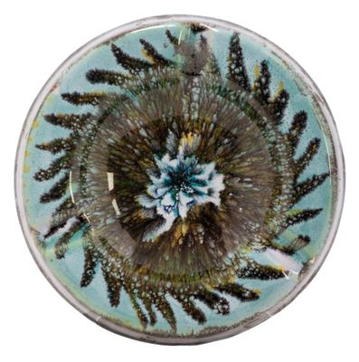 a picture of a glass bowl with a flower inside of it