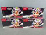 three boxes of pokemon trading cards sitting on top of a table