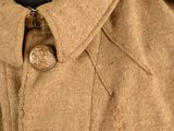 a close up of a jacket with a button on it