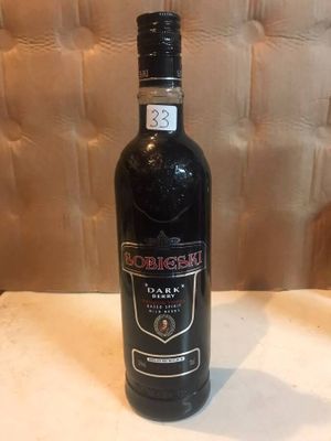 an image of a bottle of liquor sitting on top of a table