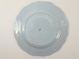 a blue plate with a blue flower on it