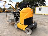 a yellow machine that is sitting in the dirt